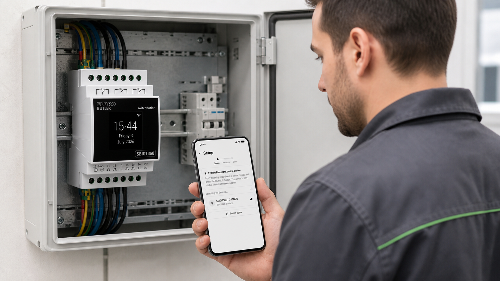 Installer configuring an SBIOT360 in an electrical cabinet with switchButler IoT Setup